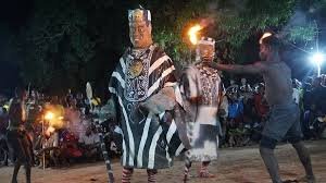 Puppetry performances, marionette displays, masquerades, storytelling, live music, dramatic re-enactments of social and historical themes.